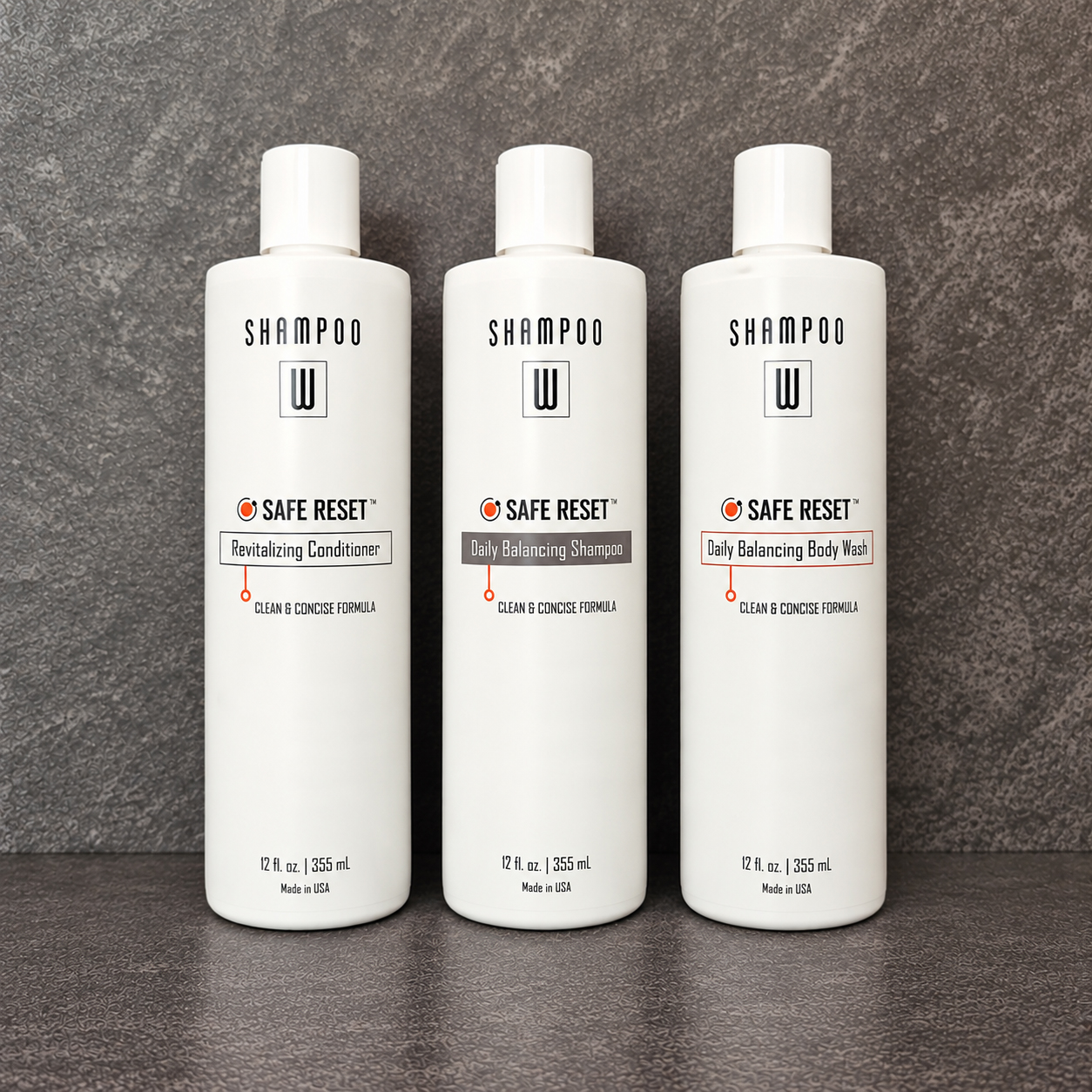 Safe Reset Trio shampoo, conditioner, and body wash bottles in a bath tile setting