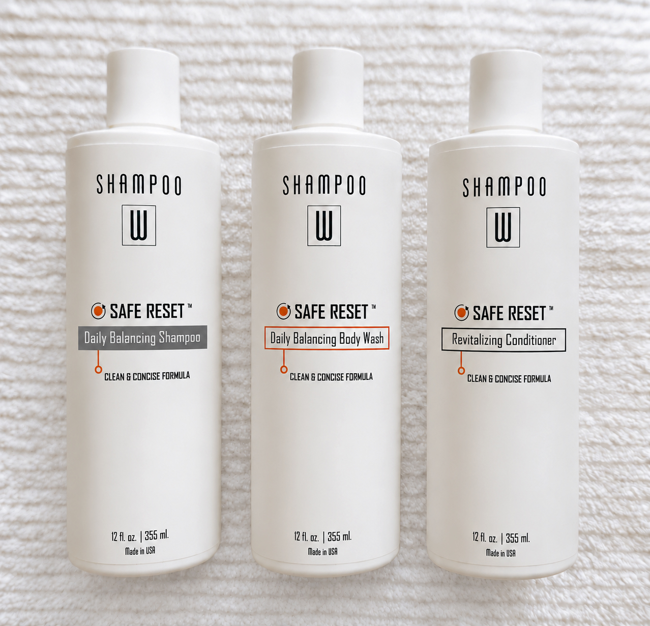 Safe Reset Trio shampoo, conditioner, and body wash bottles