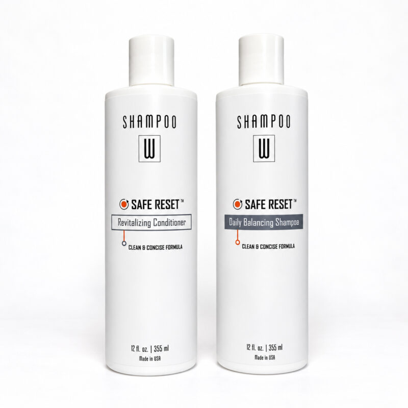 Safe Reset Duo featuring Revitalizing Conditioner and Daily Balancing Shampoo bottles side by side on a white background